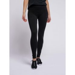 Damskie legginsy Hummel hmlSommer. Czarne legginsy Hummel, bez wzorów, z bawełny, sportowe. Za 114.50 zł.