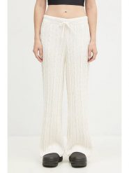 Adidas Spodnie dresowe "KNTD Jogger" w kolorze kremowym rozmiar: S. Brązowe spodnie dresowe adidas, bez wzorów, z dresówki. Za 204.40 zł.