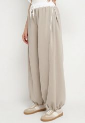 Beżowe Spodnie Dresowe z Wiskozą Wysokim Stanem i Lampasami Maithena. Brązowe jeansy Born2be, bez wzorów, z dresówki, eleganckie, z podwyższonym stanem. Za 139.99 zł.
