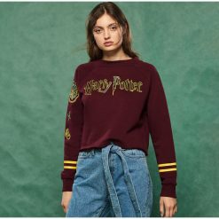 Bluza z naszywkami Harry Potter - Bordowy. Bluzy marki KALENJI. Za 59.99 zł.