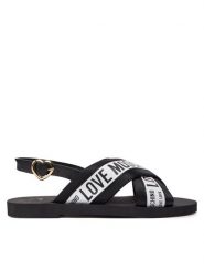 LOVE MOSCHINO Sandały JA16412G0IIX210A Biały. Białe sandały Love Moschino, bez wzorów, ze skóry, bez obcasa, na płaskiej podeszwie, bez zapięcia. Za 899.99 zł.