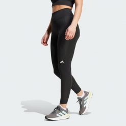 Legginsy Own the Run 7/8. Fioletowe legginsy adidas, bez wzorów, z materiału, sportowe. Za 279.00 zł.