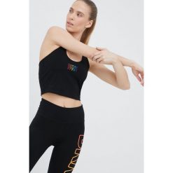 Dkny top kolor czarny. Czarne topy DKNY, l, bez wzorów, z dzianiny, młodzieżowe, bez kołnierzyka, bez ramiączek. W wyprzedaży za 249.99 zł.