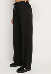 Czarne Spodnie z Gumką w Pasie i Wsuwanymi Kieszeniami Tosille. Czarne jeansy Born2be, l, bez wzorów, z jeansu, eleganckie. Za 59.99 zł.