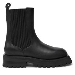 Sztyblety DKNY. Czarne botki DKNY, bez wzorów, bez obcasa, na płaskiej podeszwie, bez zapięcia. Za 729.99 zł.