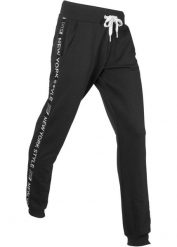 Spodnie dresowe ze ściągaczem i napisem. Czarne spodnie dresowe bonprix, bez wzorów, z dresówki. Za 132.99 zł.