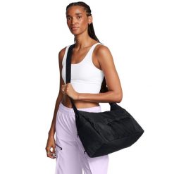Elastyczna torba sportowa damska Under Armour Studio. Czarne torby sportowe Under Armour, bez wzorów, z materiału. Za 278.50 zł.