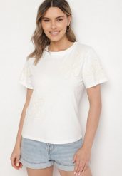 Biały T-shirt z Kwiatowymi Aplikacjami Tilenna. Białe t-shirty Born2be, l, z aplikacjami, z jeansu, eleganckie, bez kołnierzyka, bez ramiączek. W wyprzedaży za 63.74 zł.