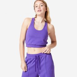 Koszulka bez rękawów damska Domyos Gym & Pilates 520 Crop. Fioletowe t-shirty sportowe DOMYOS, m, bez wzorów, z bawełny, bez ramiączek, na fitness i siłownię. Za 99.99 zł.