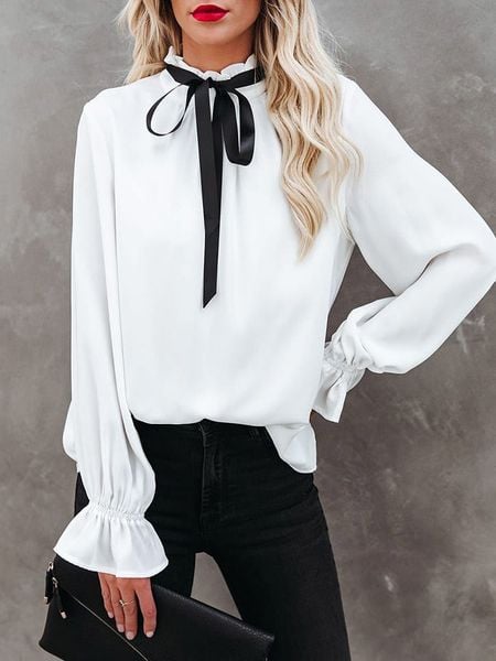 Milan Kiss Bluzka w kolorze białym rozmiar: M. Białe bluzki Milan Kiss, m, bez wzorów, bez kołnierzyka, bez ramiączek. Za 156.95 zł.