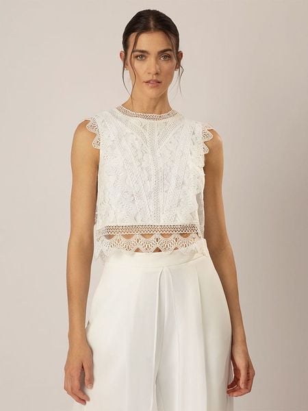 APART Top w kolorze białym rozmiar: 42. Białe topy Apart, bez wzorów, z koronki, bez kołnierzyka, bez ramiączek. Za 180.06 zł.