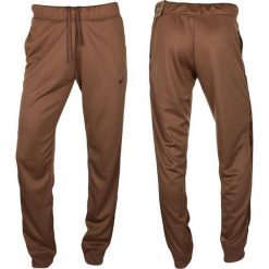 Spodnie Sportowe damskie NSW PK Tape Reg. Brązowe spodnie dresowe Nike, bez wzorów, długie. Za 224.25 zł.