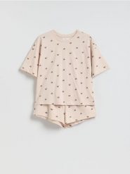 Dwuczęściowa piżama w serca - kremowy. Białe piżamy Reserved, l, bez wzorów, z bawełny, bez kołnierzyka, bez ramiączek. Za 69.99 zł.