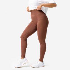 Legginsy fitness damskie Domyos Push Up. Brązowe legginsy DOMYOS, bez wzorów, z elastanu, sportowe. Za 129.99 zł.