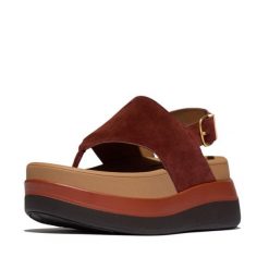 Kobiece zamszowe sandały na koturnie z tylnym zapięciem FitFlop F-Mode. Brązowe sandały FIT FLOP, bez wzorów, z materiału, bez obcasa, na koturnie, bez zapięcia. Za 617.00 zł.