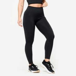 Legginsy do treningu siłowego damskie Domyos seamless. Czarne legginsy DOMYOS, bez wzorów, z elastanu, sportowe. Za 99.99 zł.