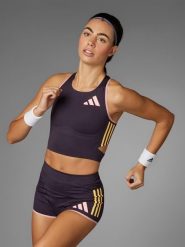 Adidas Top w kolorze fioletowym do biegania rozmiar: XS. Różowe topy sportowe adidas, xs, bez wzorów, do biegania. Za 114.44 zł.