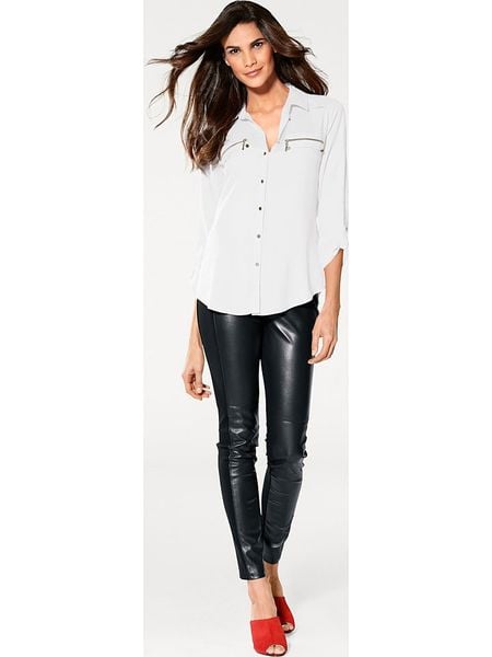 Heine Bluzka w kolorze białym rozmiar: 38. Białe bluzki Heine, bez wzorów, z wiskozy, bez kołnierzyka, bez ramiączek. Za 56.79 zł.