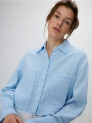 Muślinowa koszula - jasnoniebieski. Niebieskie koszule Reserved, l, bez wzorów, z bawełny, bez kołnierzyka, bez ramiączek. W wyprzedaży za 35.99 zł.