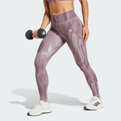 Legginsy Optime Full-Length Print. Czarne bielizna termoaktywna damska adidas, bez wzorów, z materiału, bez ramiączek. W wyprzedaży za 250.45 zł.