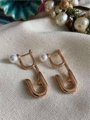 Luseera Pozłacane kolczyki rozmiar: onesize. Czerwone kolczyki Luseera, z perłą, pozłacane. Za 43.99 zł.