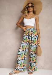 Granatowo-Niebieskie Szerokie Spodnie z Wiskozy High Waist w Kwiaty Wykończone Gumką w Talii Dennea. Niebieskie jeansy Renee, na lato, bez wzorów, z jeansu, z podwyższonym stanem. W wyprzedaży za 29.99 zł.