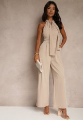 Beżowy Kombinezon Wide Leg z Ozdobnym Wiązaniem przy Szyi Silelia. Brązowe sukienki Renee, na co dzień, l, bez wzorów, eleganckie, bez kołnierzyka, bez ramiączek, kopertowe. W wyprzedaży za 111.99 zł.