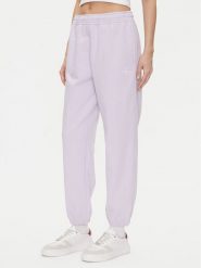 Calvin Klein Jeans Spodnie dresowe Monologo LV047B235G Fioletowy Regular Fit. Fioletowe spodnie dresowe Calvin Klein Jeans, bez wzorów, z bawełny. Za 399.99 zł.