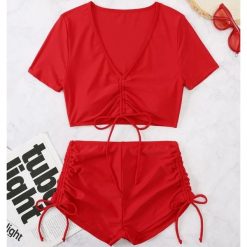 Strój kąpielowy z szortami i crop topem szybkoschnący na plażę Rutt. Czerwone stroje jednoczęściowe Intica, bez wzorów, z materiału, eleganckie. Za 129.00 zł.