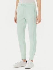 Guess Spodnie dresowe V2YB18 K7UW2 Zielony Regular Fit. Zielone spodnie dresowe Guess, z aplikacjami, z dresówki. Za 249.99 zł.