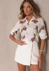 Biała Koszula z Bawełną ze Wzorem Ptaków Lumevire. Białe koszule Renee, l, z aplikacjami, z bawełny, eleganckie, bez kołnierzyka, bez ramiączek. W wyprzedaży za 63.99 zł.