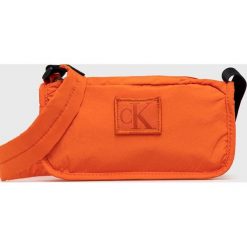 Calvin Klein Jeans saszetka kolor pomarańczowy. Brązowe nerki i saszetki Calvin Klein Jeans, bez wzorów, z jeansu, bez dodatków. W wyprzedaży za 188.99 zł.