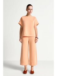 Rich & Royal Spodnie w kolorze pomarańczowym rozmiar: M. Pomarańczowe spodnie materiałowe Rich & Royal, bez wzorów, z materiału. Za 179.95 zł.