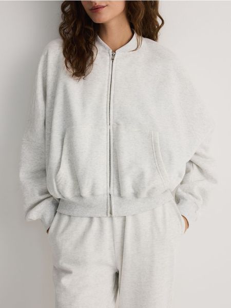Bawełniana bluza z suwakiem - jasnoszary. Szare bluzy Reserved, l, bez wzorów, z bawełny, bez kaptura. W wyprzedaży za 69.99 zł.