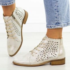 Złote ażurowe botki damskie Potocki 12646. Żółte botki POTOCKI, w ażurowe wzory, z jeansu, biznesowe, bez obcasa, na płaskiej podeszwie, bez zapięcia. Za 229.00 zł.