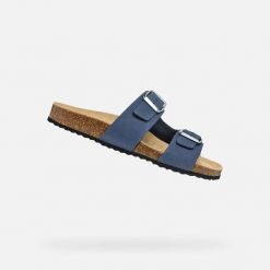 Sandały GEOX D BRIONIA Niebieski. Niebieskie sandały Geox, bez wzorów, ze skóry, bez obcasa, bez zapięcia. Za 264.99 zł.