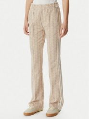 Lacoste Spodnie dresowe XF9313 Beżowy jasny Regular Fit. Brązowe spodnie dresowe Lacoste, bez wzorów, z dresówki. Za 739.99 zł.