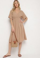 Ciemnobeżowa Bawełniana Sukienka o Rozkloszowanym Fasonie Liranelle. Brązowe sukienki Born2be, na co dzień, l, bez wzorów, z bawełny, eleganckie, bez kołnierzyka, bez ramiączek, midi, rozkloszowane. W wyprzedaży za 46.74 zł.