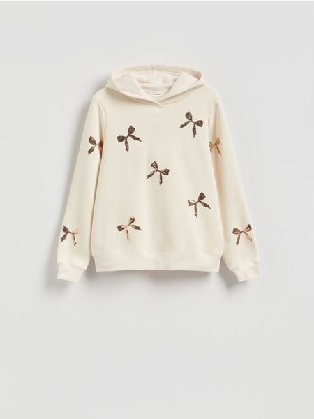 Bluza ze świątecznym motywem - złamana biel. Bluzy Reserved, l, bez wzorów, z bawełny, bez kaptura. Za 99.99 zł.