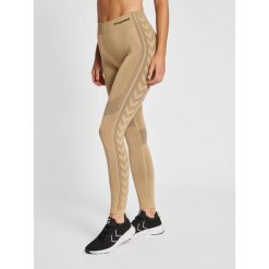 Damskie legginsy mid-rise Hummel Shaping. Brązowe legginsy Hummel, bez wzorów, z dzianiny. Za 175.50 zł.