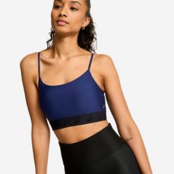 Stanik sportowy. Niebieskie biustonosze sportowe Decathlon, bez wzorów, z elastanu, na fitness i siłownię. Za 52.49 zł.