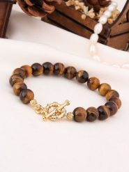 L'Atelier de Gaia Pozłacana bransoletka z tygrysim okiem rozmiar: onesize. Brązowe bransoletki L'Atelier de Gaia, pozłacane. Za 78.66 zł.