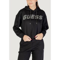 Bluza Kobieta GUESS ACTIVE PRIMULA RHINESTONES HOODIE SWE. Czarne bluzy z kapturem Guess Active, z aplikacjami, z bawełny, bez kaptura. W wyprzedaży za 333.50 zł.