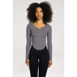 Koszulka fitness damska Gym Glamour wycięta z długimi rękawami. Szare t-shirty sportowe GYM GLAMOUR, s, bez wzorów, bez ramiączek, na fitness i siłownię. Za 149.99 zł.