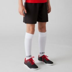 Spodenki piłkarskie dla dzieci Kipsta Essential. Czerwone szorty KIPSTA, bez wzorów, z materiału, sportowe. Za 24.99 zł.