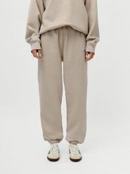 LeGer Spodnie dresowe "Maxime" w kolorze beżowym rozmiar: 38. Brązowe spodnie sportowe LeGer, bez wzorów, z dresówki. Za 105.63 zł.