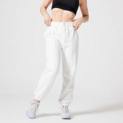 Spodnie dresowe damskie Domyos Gym & Pilates 500. Białe spodnie dresowe DOMYOS, bez wzorów, z bawełny, sportowe. W wyprzedaży za 79.99 zł.