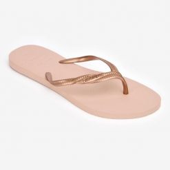 Japonki damskie Havaianas Fantasia. Czerwone japonki Havaianas, bez wzorów, z kauczuku, sportowe. W wyprzedaży za 59.99 zł.