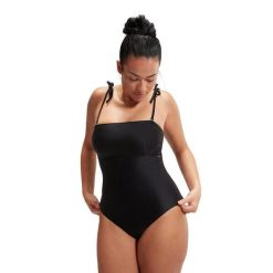 SPEEDO Modelujący kostium kąpielowy bandeau Czarny UK 38. Czarne stroje jednoczęściowe Speedo, bez wzorów, z tkaniny, sportowe. Za 354.60 zł.