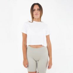 Krótkie damskie T-shirt CROPPED TEE białe. Białe t-shirty LEGEA, bez wzorów, sportowe, bez kołnierzyka, bez ramiączek. Za 52.00 zł.
